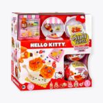 A packaged MGA's Miniverse Make It Mini Food Hello Kitty Series 1 toy set. The box showcases images of miniature food items like waffles with syrup and fruits, with predominantly red packaging that highlights the Hello Kitty branding.