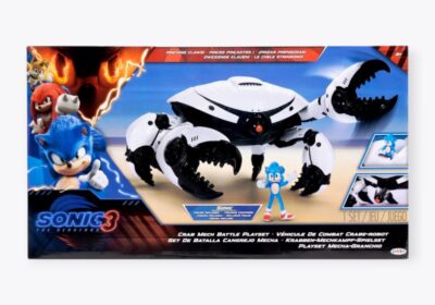 Sonic the Hedgehog 3 Crab Mech Battle Playset, featuring a robotic crab figure with packaging adorned with images of Sonic and other characters. The box includes text in multiple languages and contains a small Sonic figure inside.