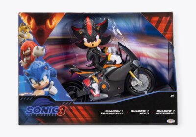 Colorful boxed playset featuring a Sonic the Hedgehog character riding a motorcycle. The packaging showcases images of other characters on the left side and has text that reads "Sonic 3" and "Shadow Motorcycle.